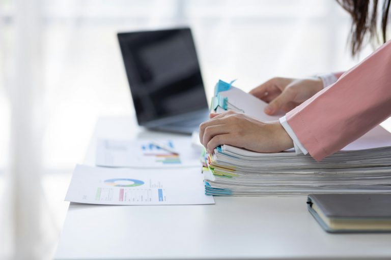 Business asian woman signs an electronic document on a digital document on a virtual laptop computer