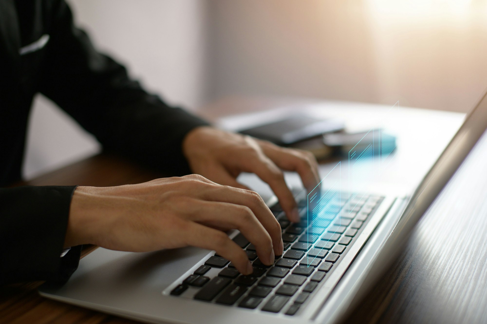 Man typing on a laptop keyboard which releases a 3D-rendered digital document